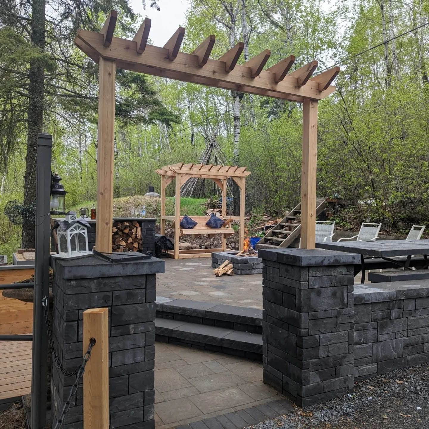 Completed pergola and stone patio installation